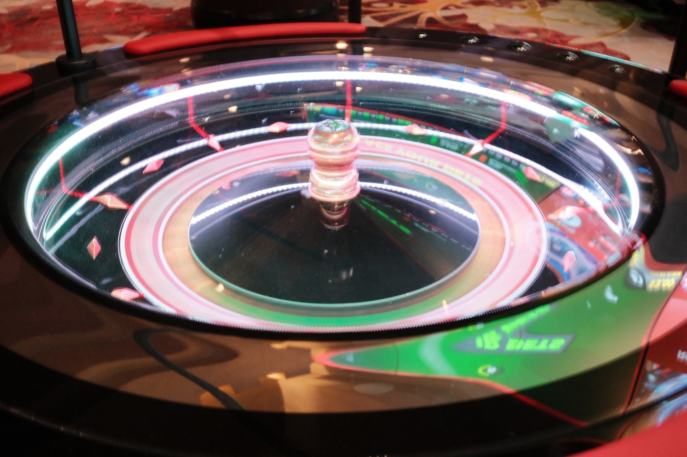 An electronic roulette terminal ringed with bright light.